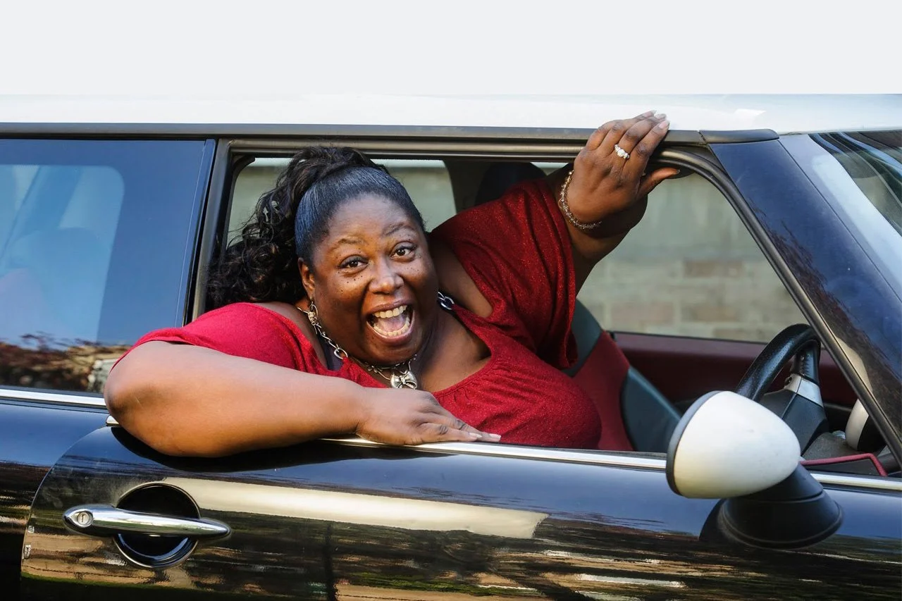 happy in a mini cooper Live.